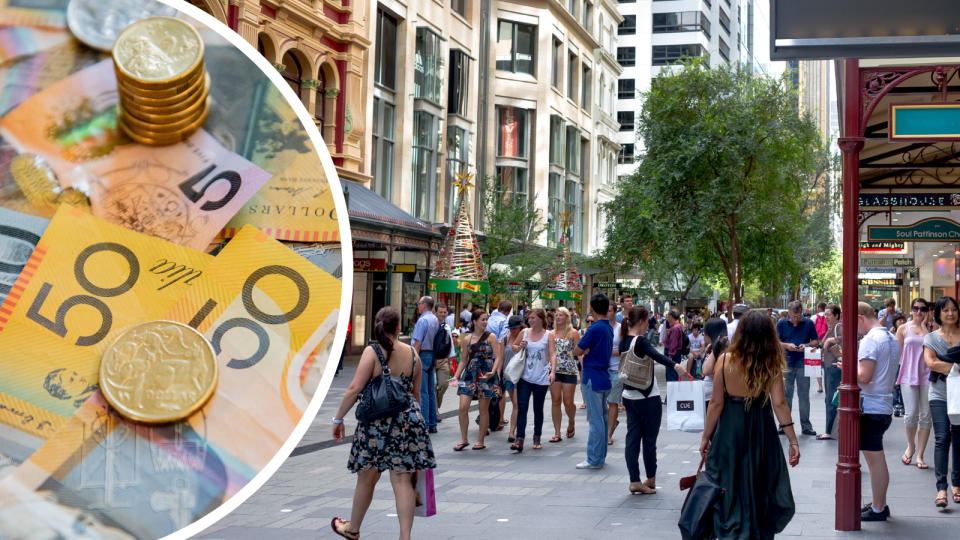 Australian money and people walking in the city through the mall. Black Friday sales concept.