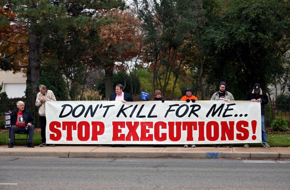 Protesters gather outside of the Governor's Mansion on Nov. 30, 2023, in Oklahoma City, Okla. before the scheduled execution of Phillip Dean Hancock for a 2001 double murder.