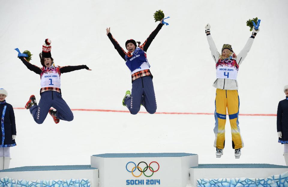 From L-R: Second-placed Canada's Kelsey Serwa, winner Canada's Marielle Thompson and third-placed Sweden's Anna Holmlund celebrate on the podium after the women's freestyle skiing skicross finals at the 2014 Sochi Winter Olympic Games in Rosa Khutor February 21, 2014. REUTERS/Dylan Martinez (RUSSIA - Tags: SPORT SKIING OLYMPICS TPX IMAGES OF THE DAY)