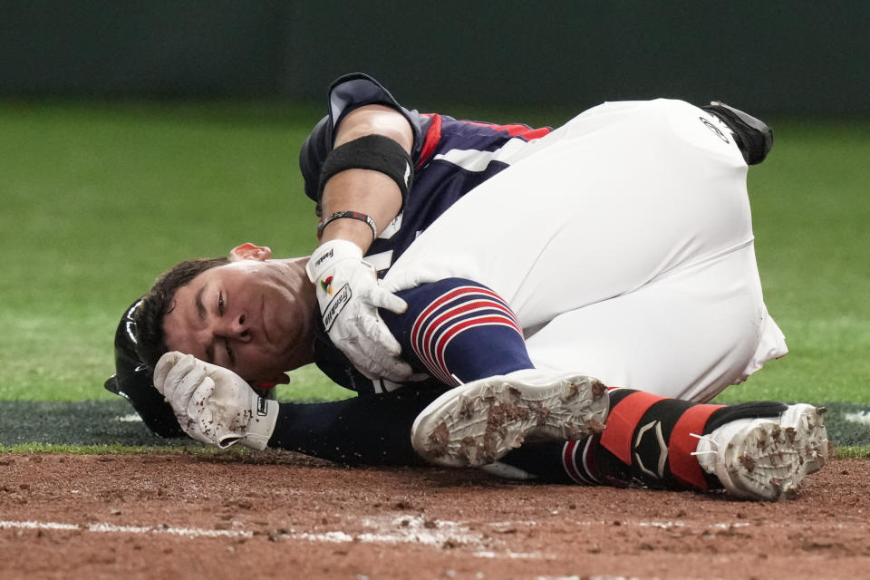 William Escala of Czech Republic reacts after he was hit by pitcher Roki Sasaki of Japan while batting during their Pool B game at the World Baseball Classic at the Tokyo Dome, Japan, Saturday, March 11, 2023. (AP Photo/Eugene Hoshiko)