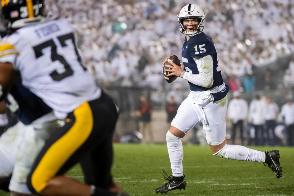 Penn State quarterback Drew Allar rolls to his right before completing a 2-yard touchdown pass to Tyler Warren during a White Out football game against Iowa Saturday, Sept. 23, 2023, in State College, Pa. The Nittany Lions shut out the Hawkeyes, 31-0.