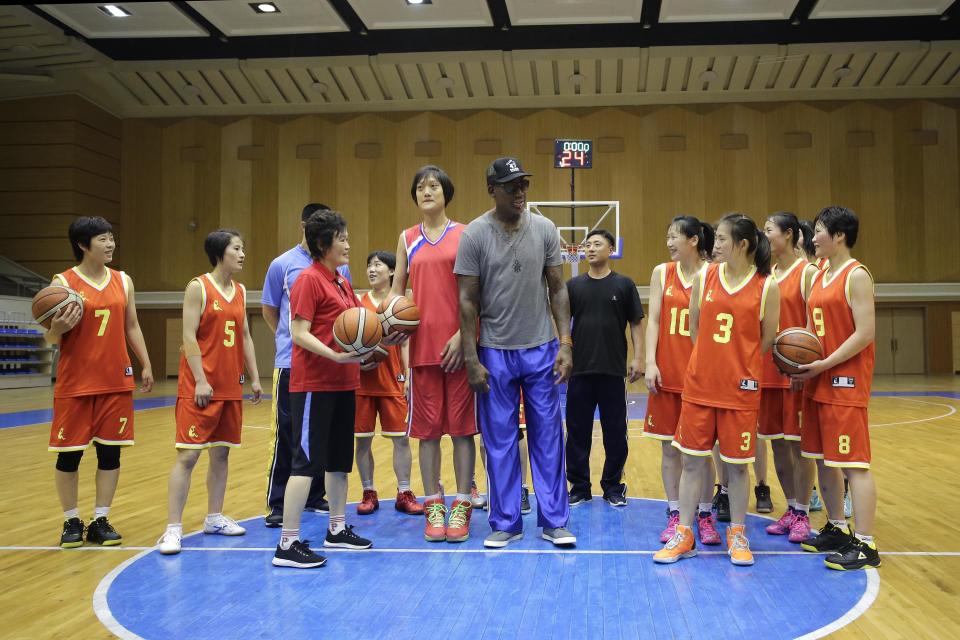 Dennis Rodman talks to the North Korea's women's basketball team during his visit to Pyongyang, North Korea, in 2017. Rodman began sightseeing in Pyongyang on Wednesday during a trip he said he hoped would "open a door" for President Donald Trump.