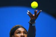 Serena Williams of the U.S. serves during her women's singles match against Silvia Soler-Espinosa of Spain at the China Open tennis tournament in Beijing September 29, 2014. REUTERS/Petar Kujundzic