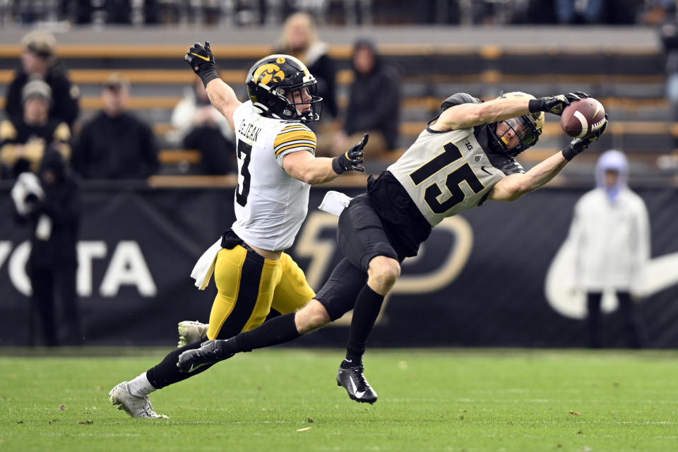 Purdue wide receiver Charlie Jones (15) misses a pass during the second half of an NCAA college football game against Iowa, Saturday, Nov. 5, 2022, in West Lafayette, Ind. (AP Photo/Marc Lebryk)