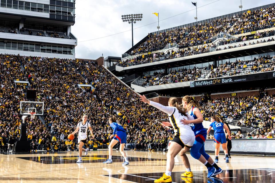 Iowa guard Kate Martin (20) dribbles during the women's basketball scrimmage between Iowa and DePaul at Kinnick Stadium in Iowa City, Iowa.