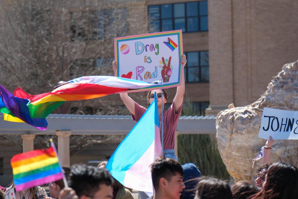 A student holds up a sign in protest at West Texas A&M University Tuesday in response to the university's president canceling an on-campus drag show in Canyon.