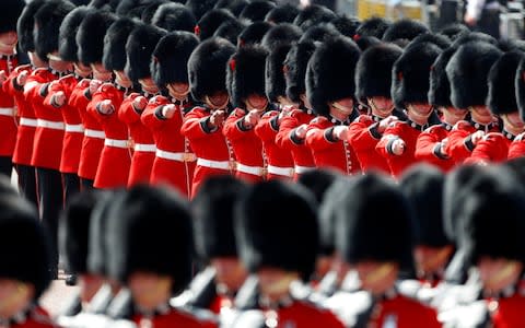 Coldstream Guards march down The Mall as part of Trooping the Colour in central London - Credit: Peter Nicholls/Reuters