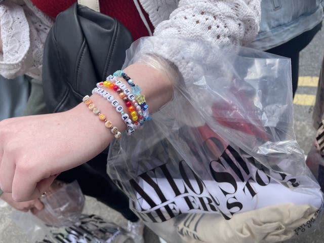 Friendship bracelets on a young girl's arm