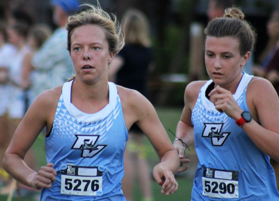 Ponte Vedra's Daisy Ross (5276) and Lindy White (5290) run during the girls elite race at the Katie Caples Invitational. The Sharks placed second behind Bishop Kenny.