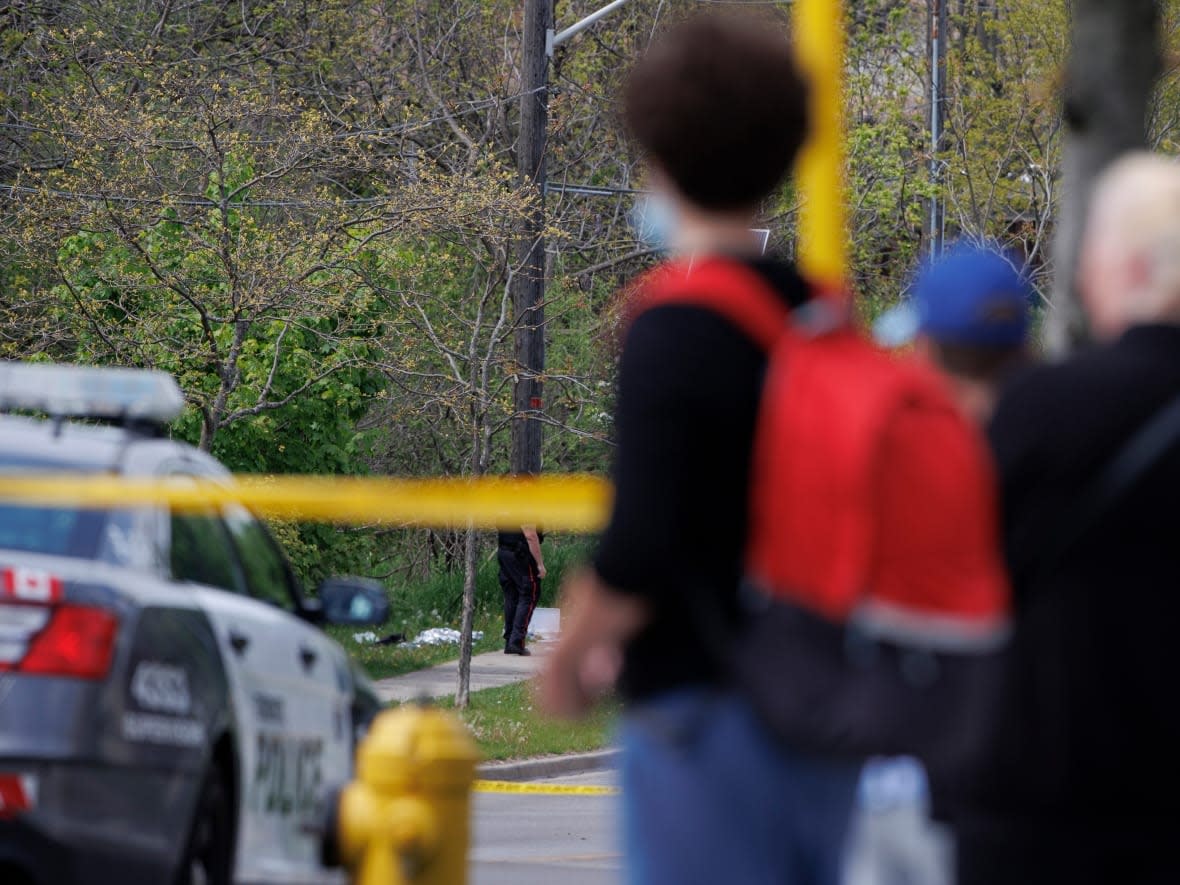 Police respond to reports of a man with a rifle near William G. Davis Junior Public School in Toronto Thursday.  (Evan Mitsui/CBC - image credit)