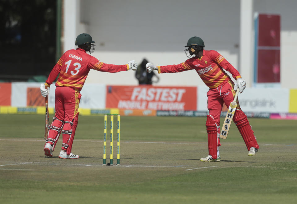 Zimbabwe batsman Tendai Chatara, left and Luke Jongwe gesture, during the second One Day International series cricket match between Zimbabwe and Bangladesh, at Harare Sports Club, in Harare, Sunday, July 18, 2021. (AP Photo/Tsvangirayi Mukwazhi)