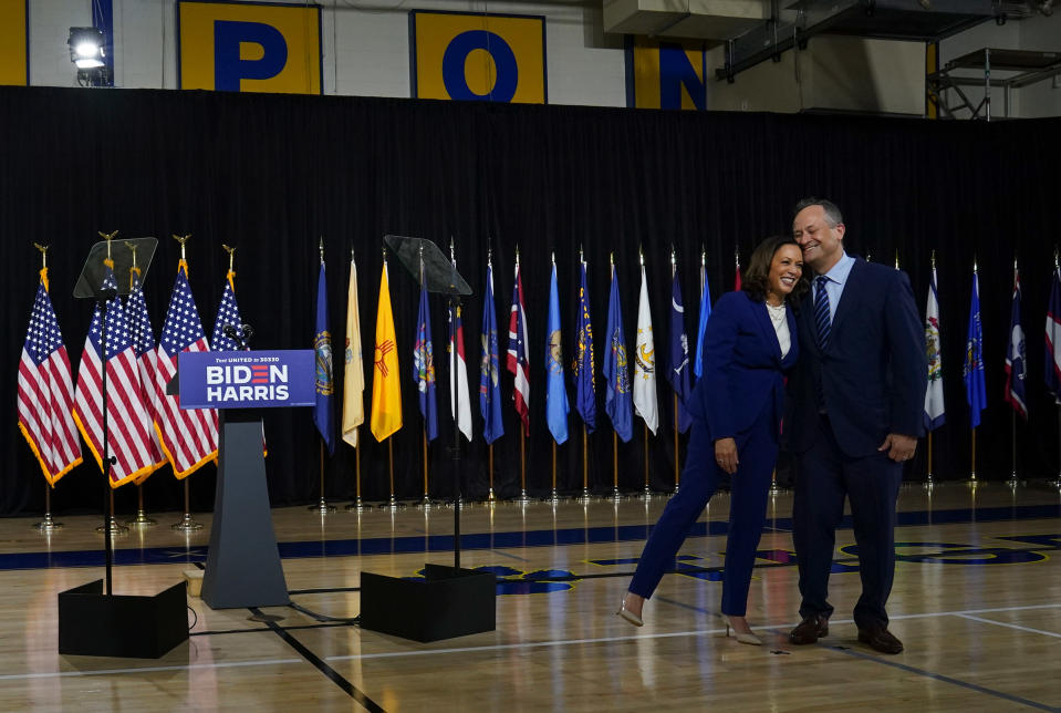 Sen. Kamala D. Harris leans on her husband Doug Emhoff after being introduced by presumptive Democratic presidential nominee Joe Biden as his running mate during an event in Wilmington, Del., on Aug. 12, 2020.<span class="copyright">Toni L. Sandys—The Washington Post/Getty Images</span>