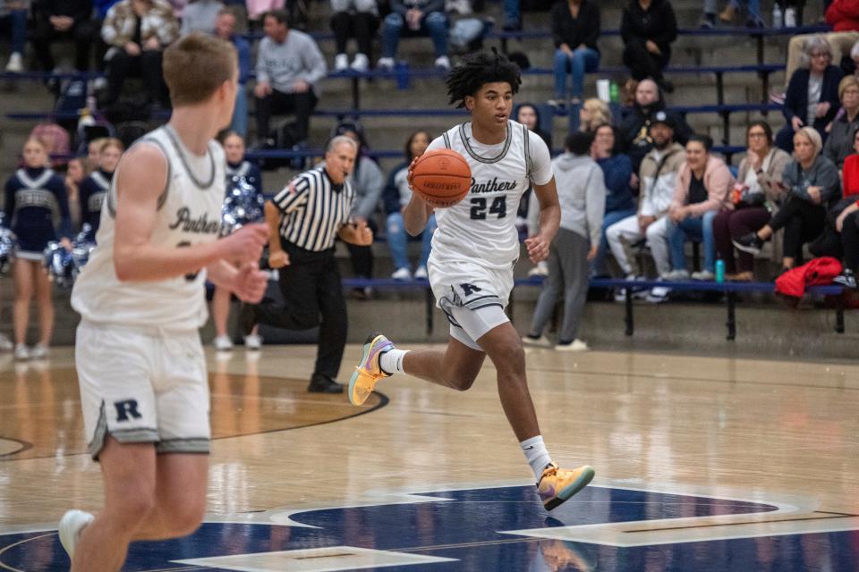 Reitz’s Jaylan Mitchell (24) dribbles up court as the Reitz Panthers play the North Huskies Tuesday, Dec. 12, 2023.