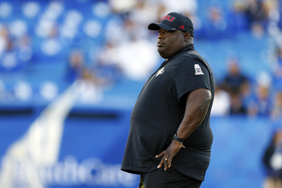 Northern Illinois head coach Thomas Hammock watches his team warm up before an NCAA college football game against Kentucky in Lexington, Ky., Saturday, Sept. 24, 2022. (AP Photo/Michael Clubb)