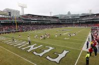 Louisville meets Cincinnati during the first quarter of the Fenway Bowl NCAA college football game at Fenway Park Saturday, Dec. 17, 2022, in Boston. (AP Photo/Winslow Townson)