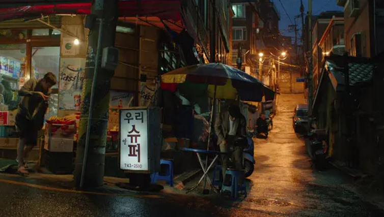 <span class="caption">Authentic: a Korean street scene in Parasite.</span> <span class="attribution"><span class="source">Curzon Artificial Eye</span></span>