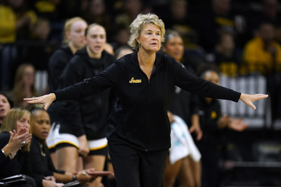 Iowa head coach Lisa Bluder directs her team during the first half of an NCAA college basketball game against Bowling Green, Saturday, Dec. 2, 2023, in Iowa City, Iowa. (AP Photo/Charlie Neibergall)