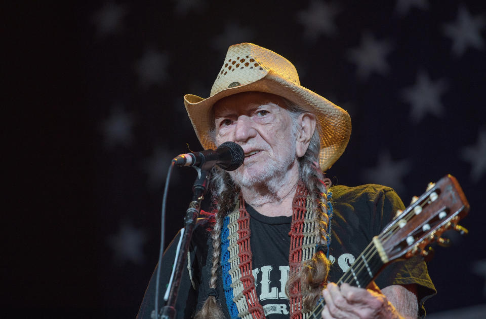 Willie Nelson, pictured in July, has apparently shocked some of his fans by supporting a liberal candidate. (Photo: Rick Kern/WireImage)