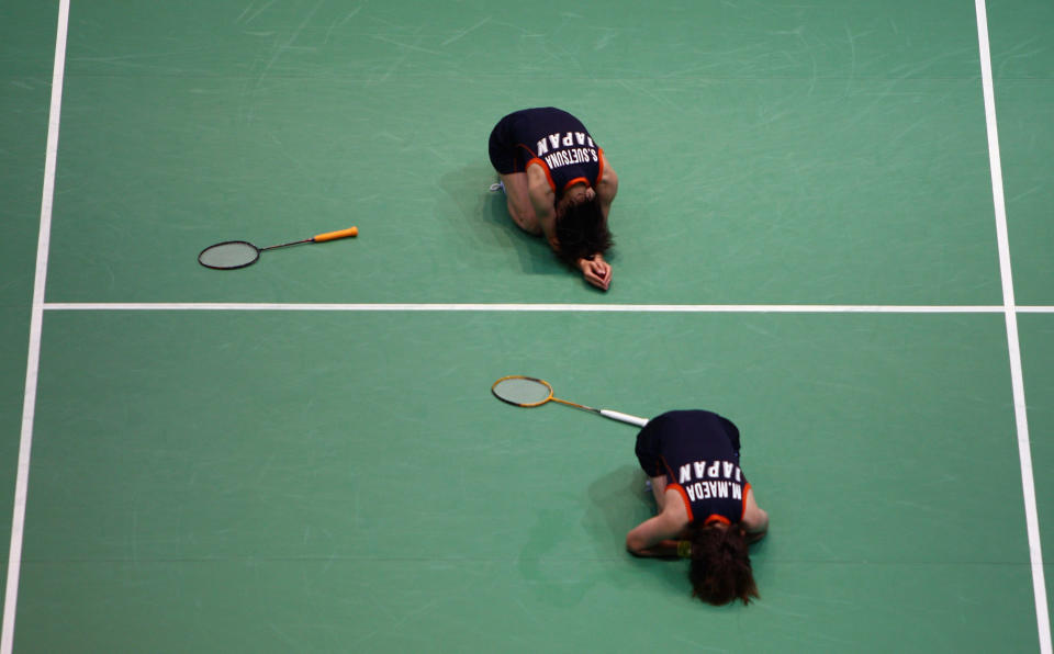 BEIJING - AUGUST 11: Miyuki Maeda and Satoko Suetsuna of Japann celebrate after match point during their Women's Doubles match against Wei Yang and Jiewen Zhang of China at the Beijing University of Technology Gymnasium on Day 3 of the Beijing 2008 Olympic Games on August 11, 2008 in Beijing, China. (Photo by Michael Steele/Getty Images)