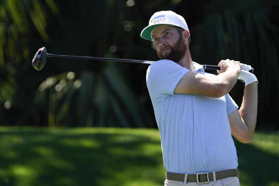 Chris Kirk watches his tee shot on the seventh hole during the second round of the The Players Championship golf tournament Friday, March 12, 2021, in Ponte Vedra Beach, Fla. (AP Photo/John Raoux)