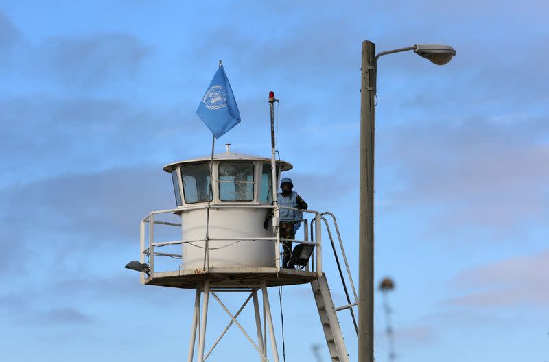 A U.N. peacekeeper of the United Nations Interim Force in Lebanon (UNIFIL) stands on United Nation's observation point near Naqoura