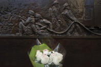 <p>A bouquet of roses is placed at a memorial wall outside Ladder 10 Engine 10 , Monday, Sept. 11, 2017, at the World Trade Center in New York. Thousands of 9/11 victims’ relatives, survivors, rescuers and others gathered Monday at the World Trade Center to remember the deadliest terror attack on American soil. During the attacks of Sept. 11, 2001, 343 firefighters were killed. (AP Photo/Mark Lennihan) </p>