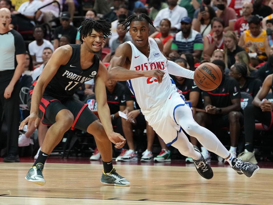 Detroit Pistons guard Jaden Ivey dribbles against Portland Trail Blazers guard Shaedon Sharpe during an NBA Summer League game on July 7, 2022, in Las Vegas.