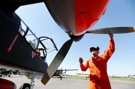 A technician prepares to start the engine of an OV-10 Bronco aircraft at Flanders international airport, ahead of the world's first Short Take Off & Landing competition on sand, in Wevelgem, Belgium May 8, 2018. REUTERS/Francois Lenoir