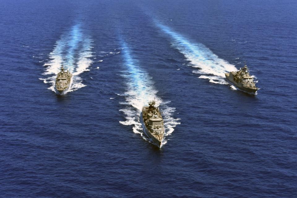 In this photo provided by the Greek Defense Ministry, warships take part in a military exercise in Eastern Mediterranean sea, on Tuesday, Aug. 25, 2020. Germany's foreign minister appealed to NATO allies Greece and Turkey to deescalate military tensions in the eastern Mediterranean, warning Tuesday that "any spark, however small, could lead to a disaster." (Greek Defense Ministry via AP)