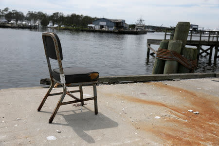 An empty chair sits at a dock in Wanchese, North Carolina, U.S., May 30, 2017. Picture taken May 30, 2017. REUTERS/Shannon Stapleton