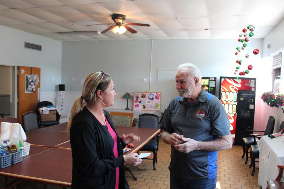 Crestview Manor Facility Director Lavina Brock accepts a $500 check from Crestview AmVets Post #35 Commander Virgil Talbott on Monday. The donation will be used to renovate one room at the Manor.