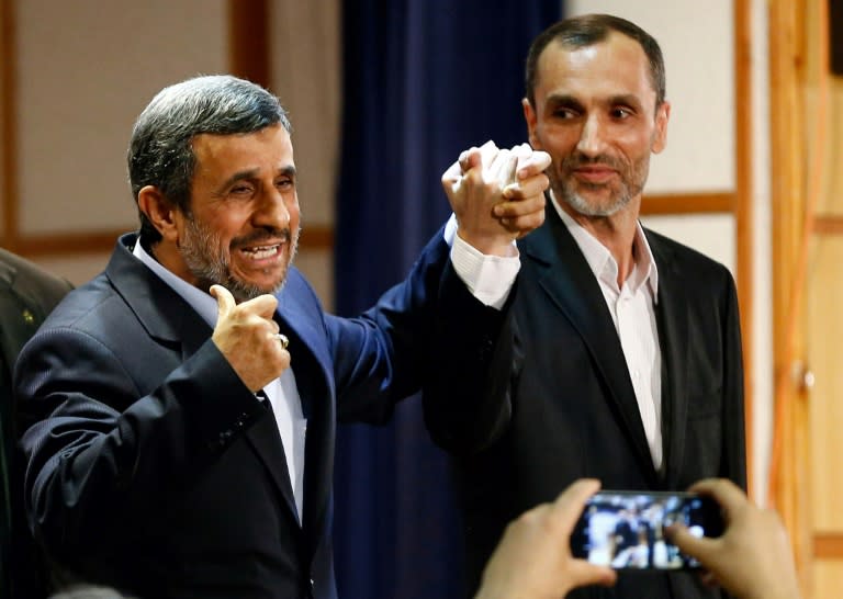 Former Iranian president Mahmoud Ahmadinejad stands with former Iranian vice president Hamid Baghaei after registering at the interior ministry's election headquarters on April 12, 2017, as candidates sign up for the upcoming presidential elections