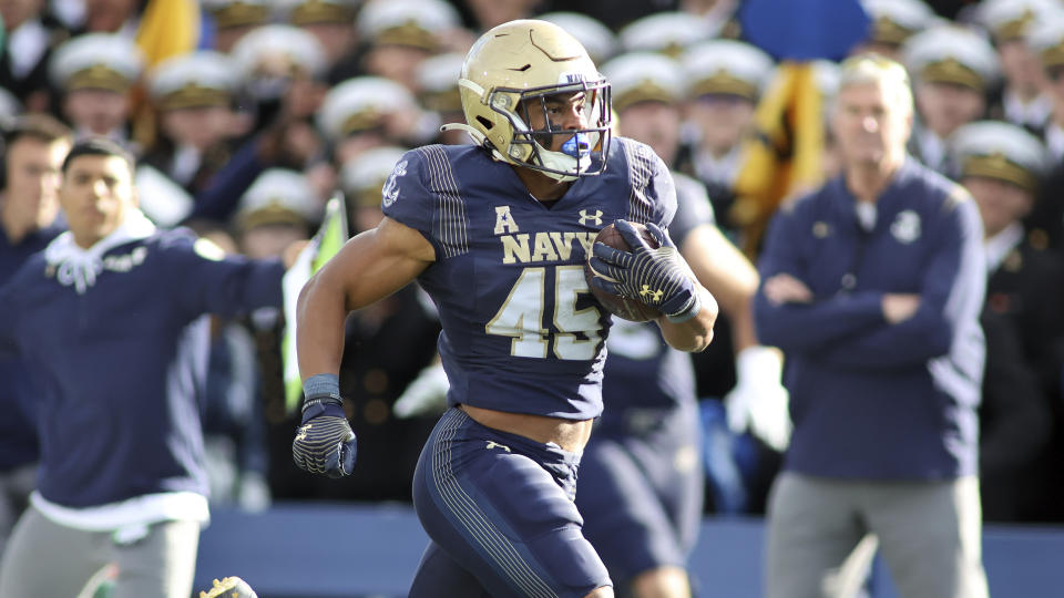 FILE - Navy Midshipmen fullback Daba Fofana (45) runs during an NCAA football game against the Tulsa Golden Hurricane on Oct. 8 2022, in Annapolis, Md. Notre Dame will face Navy in Dublin, Ireland, for their season opener on Saturday, Aug. 26, 2023. Navy fullback Fofana, who led the team with 769 rushing yards in 2022, said the backs have been working on pass-catching. (AP Photo/Daniel Kucin Jr., File)