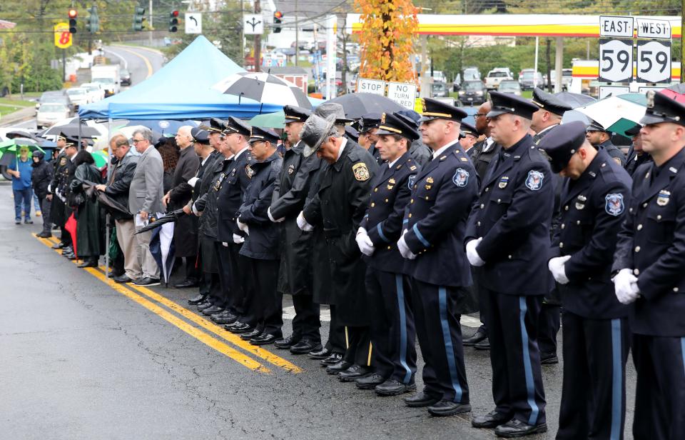Police, elected officials and friends line the street during the 42nd annual Brinks robbery memorial service for slain Nyack Police Sergeant Edward O'Grady, Police Officer Waverly L. Brown and Brinks guard Peter Paige, during the ceremony on Mountainview Avenue in Nyack, Oct. 20, 2023.