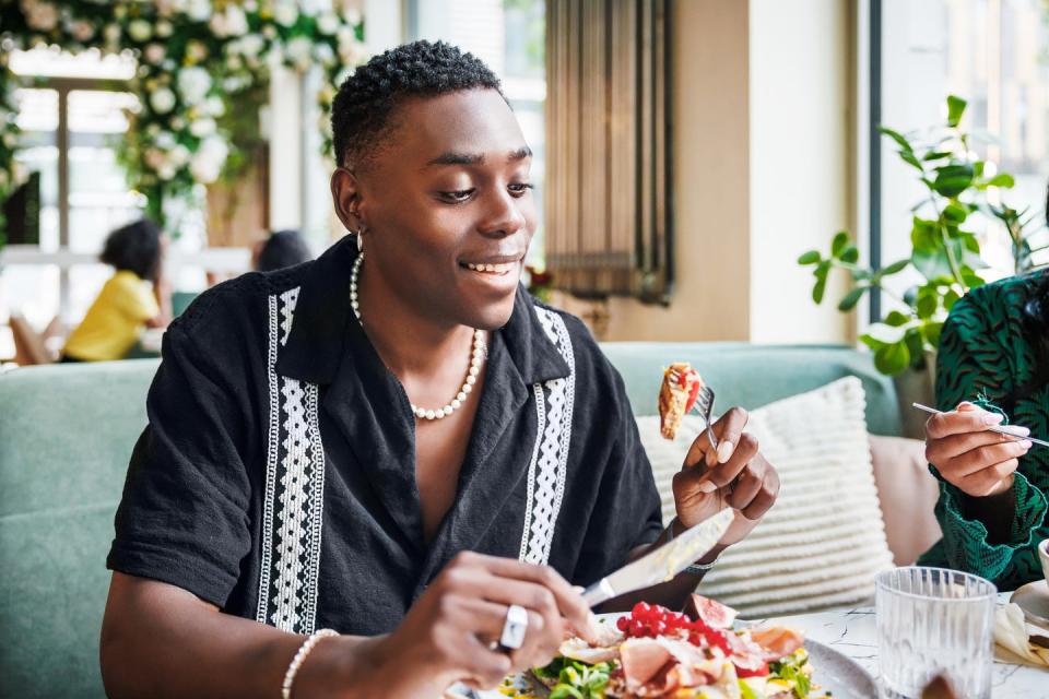 man savoring fresh salad