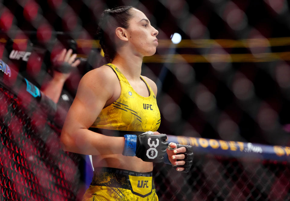 Dec 16, 2023; Las Vegas, Nevada, USA; Ariane Lipski (blue gloves) during UFC 296 at T-Mobile Arena. Mandatory Credit: Stephen R. Sylvanie-USA TODAY Sports