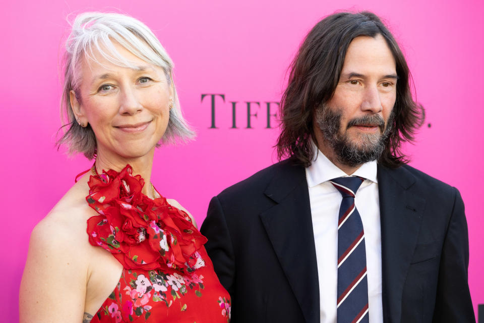 Keanu Reeves and his longtime girlfriend, artist Alexandra Grant, kissed on the red carpet. (Photo: Elyse Jankowski/FilmMagic)