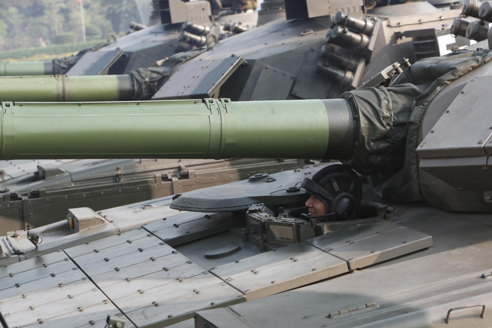 A military officer sits in a tank during a parade to commemorate Myanmar's 78th Armed Forces Day in Naypyitaw, Myanmar, Monday, March 27, 2023. (AP Photo/Aung Shine Oo)