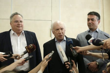 FILE PHOTO: Greek Foreign Minister Nikos Kotzias (L), UN envoy Matthew Nimetz (C) and Foreign Minister of Macedonia Nikola Dimitrov speak to the media after their meeting in Sounion, Greece, May 12, 2018. John Liakos/Intimenews via REUTERS