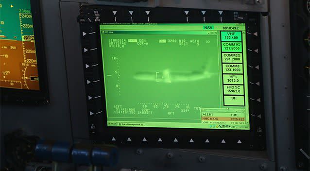 n image of a U.S. P-8 Poseidon is be seen on a monitor in the cockpit of a Royal New Zealand Air Force P-3 Orion while flying to the search zone to help find the missing Malaysia Airlines Flight MH370 in Perth. Photo: AP.