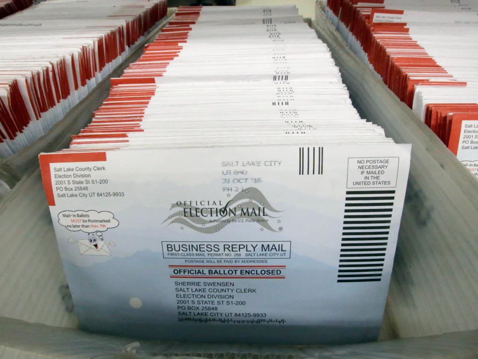 FILE - In this Nov. 1, 2016, file photo, mail-in ballots for the 2016 General Election are shown at the elections ballot center at the Salt Lake County Government Center, in Salt Lake City. As President Donald Trump rails against voting by mail, many members of his own political party are embracing it to keep their voters safe during the coronavirus outbreak. (AP Photo/Rick Bowmer, File)