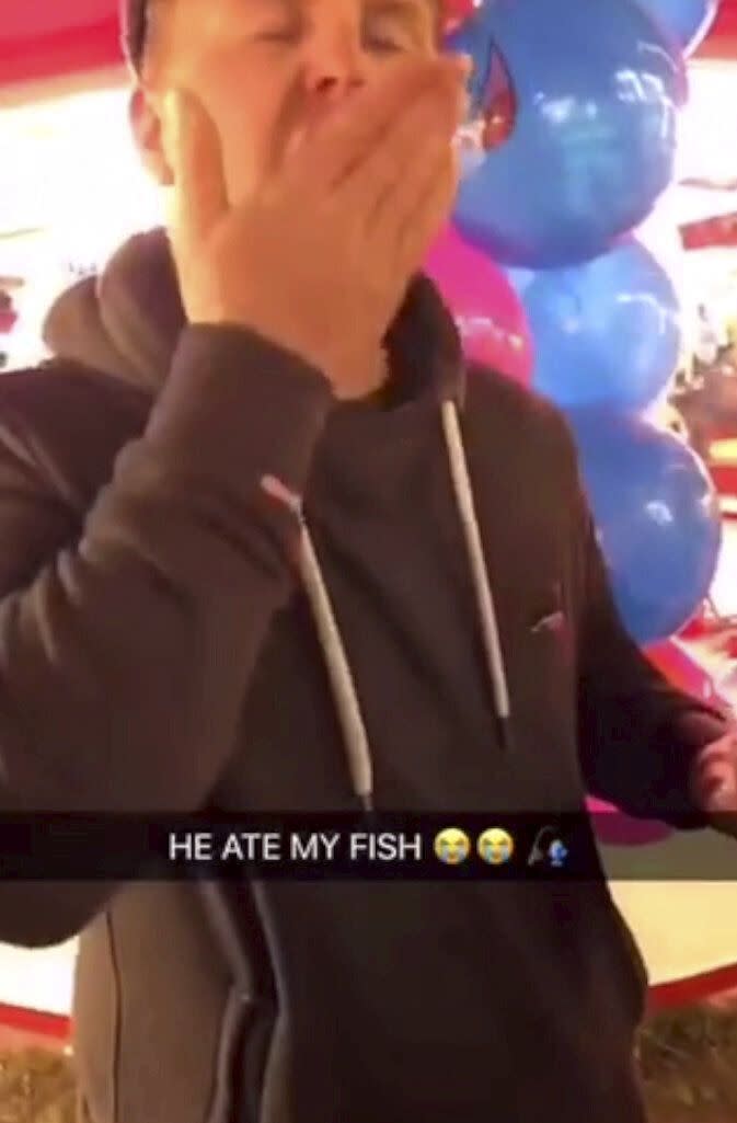 Joshua Coles, 27, of Tiverton, Devon, was filmed swallowing a goldfish which had been won at Bridgwater Fair last year. He was fined £300 and banned from keeping fish for five years. The fair has confirmed it will no longer offer fish as prizes. (SWNS)