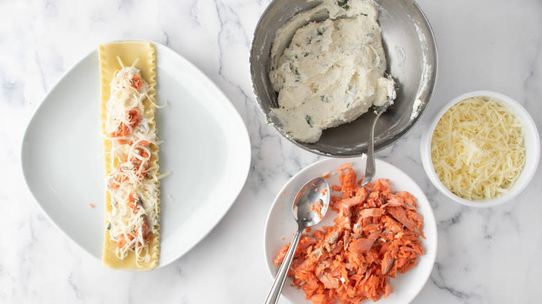 assembling lasagna rolls with ingredients