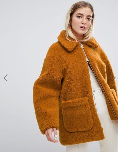This ochre teddy coat has a zip-front closure and front pockets. <strong><a href="https://fave.co/2A5BhTr" target="_blank" rel="noopener noreferrer">Find it for $143 at ASOS</a></strong>.