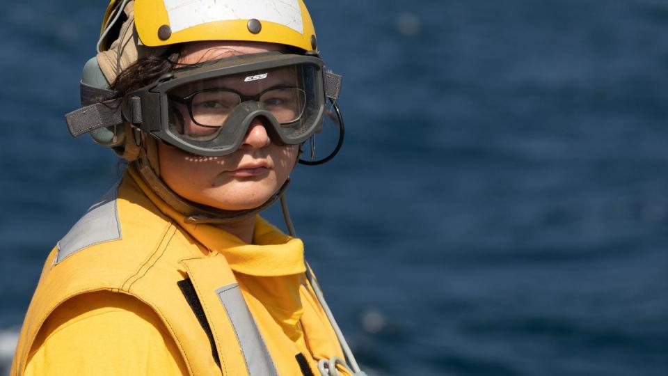 A sailor stands ready during flight quarters aboard the Navy destroyer Gravely in the Red Sea on  Jan. 5, 2024. Gravely and other destroyers have been shooting down a steady stream of attack drones and missiles fired by Iran-backed Houthi rebels in Yemen since October. (Mass Communication Specialist 1st Class Jonathan Word/Navy)