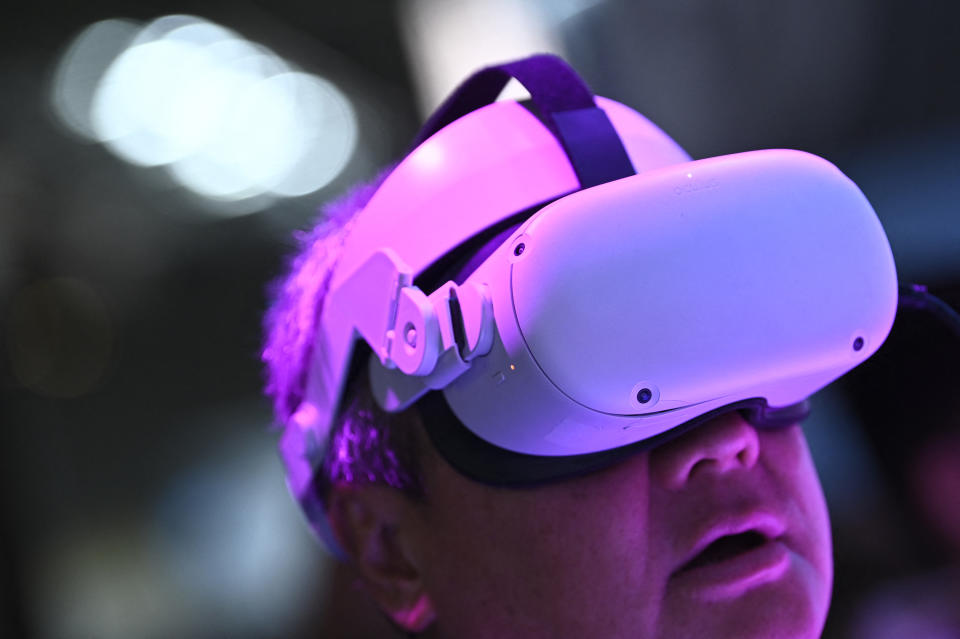 A person tries an Oculus Meta Quest virtual reality headset at the Mobile World Congress (MWC), the telecom industry&#39;s biggest annual gathering, in Barcelona on February 28, 2023. (Photo by Josep LAGO / AFP) (Photo by JOSEP LAGO/AFP via Getty Images)