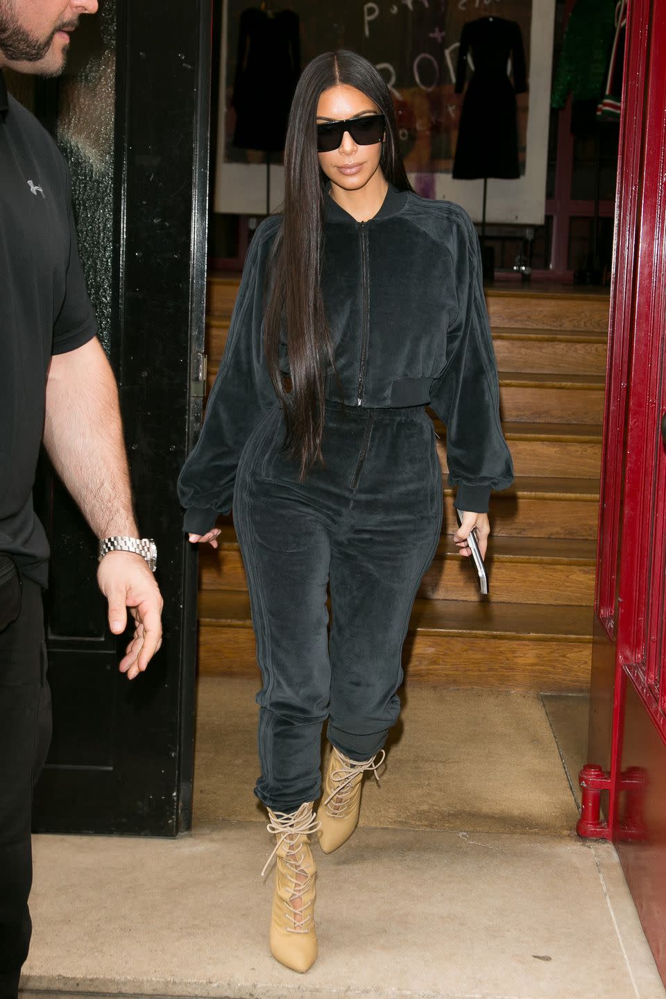 <p>Out shopping in Paris in a velour tracksuit and heeled boots. </p>