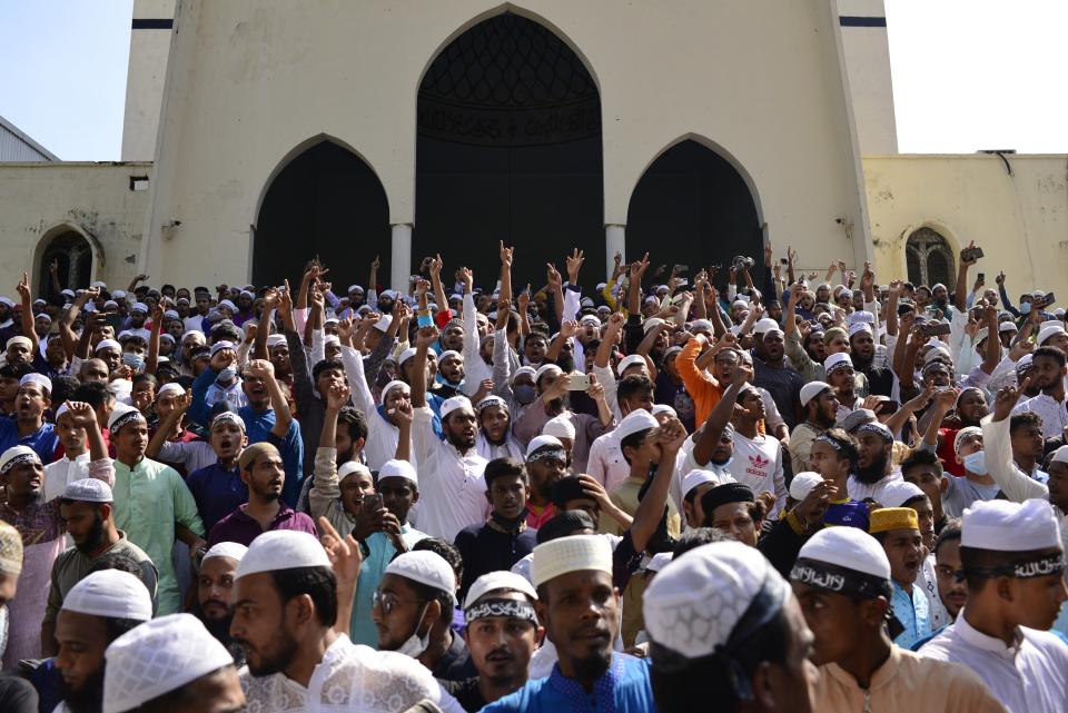 Muslim devotees shout slogans during a protest over an alleged insult to Islam, outside the country’s main Baitul Mukarram Mosque in Dhaka, Bangladesh, Friday, Oct. 15, 2021. Friday’s chaos in Dhaka followed reported incidents of vandalism of Hindu temples in parts of the Muslim-majority Bangladesh after photographs of a copy of the Holy book Quran at the feet of of a Hindu Goddess went viral on social media in a temple at Cumilla district in eastern Bangladesh. (AP Photo/Mahmud Hossain Opu, File)