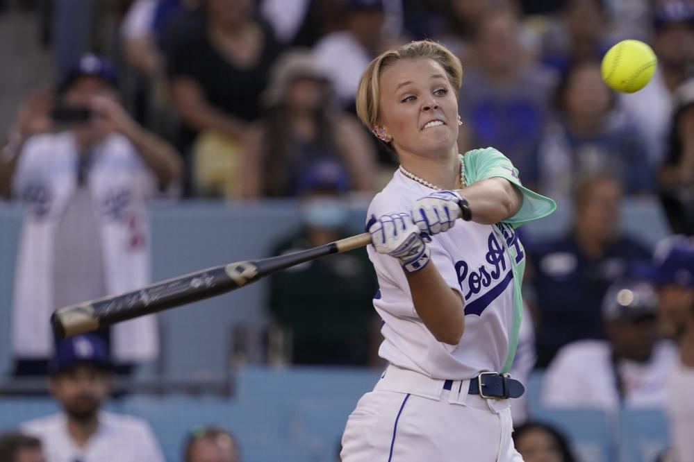 JoJo Siwa shows off her athletic side while playing in MLB All