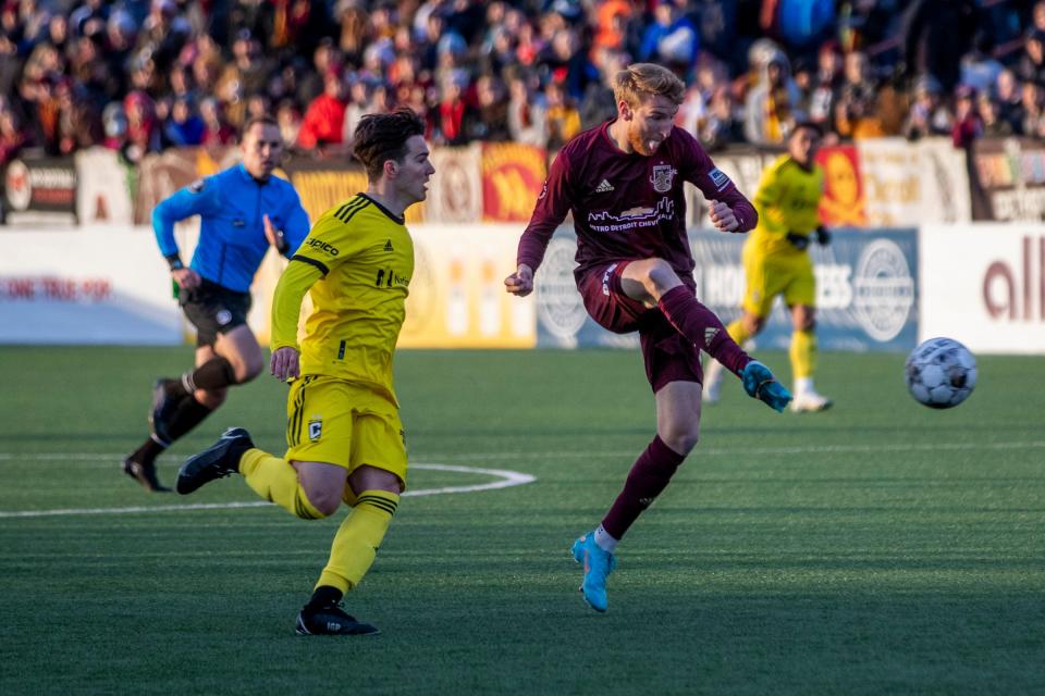 DCFC's Connor Rutz (11) moves with the ball during the game between Detroit City FC and Columbus Crew at Keyworth Stadium in Hamtramck on Tuesday, April 19, 2022.